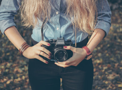 Woman with vintage retro camera